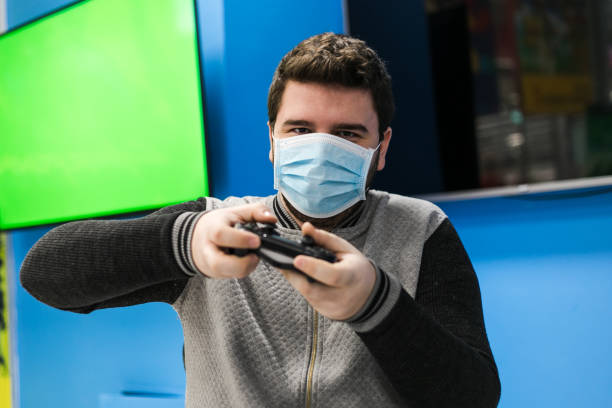 istock One guy playing video games on green screen 1297403957