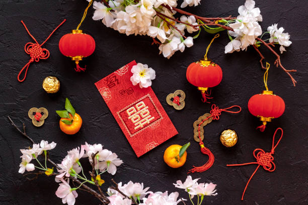 istock Chinese New Year decorations top view. Red lanterns and postcard with chatacter means double happiness 1297405948