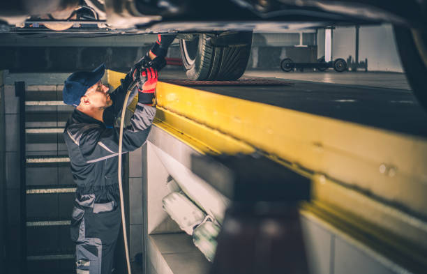 istock Car Mechanic Performing Vehicle Undercarriage Diagnostic Check 1297406481