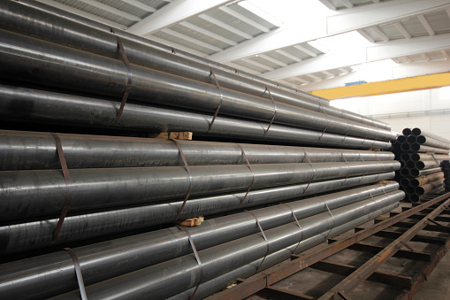 steel metal pipe stack inside factory