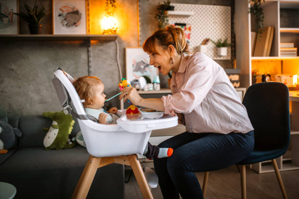 istock Mother feeding her little baby boy 1297406701