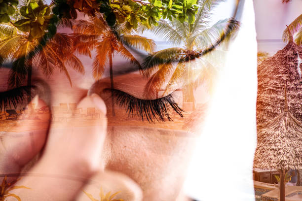 Double exposure of woman doing meditation and beach