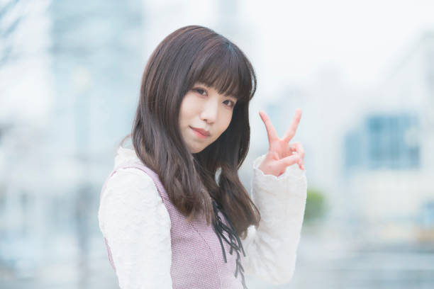 istock Young woman doing a peace sign 1297407293