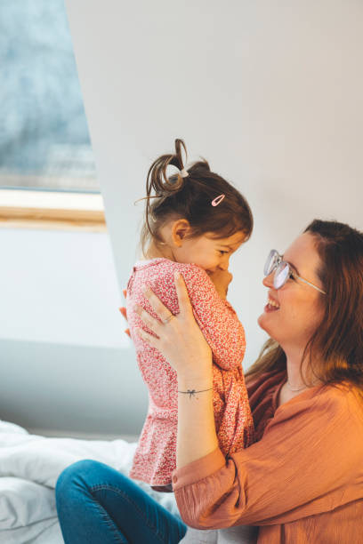 istock Cute little girl and her mother spending time together 1297408708