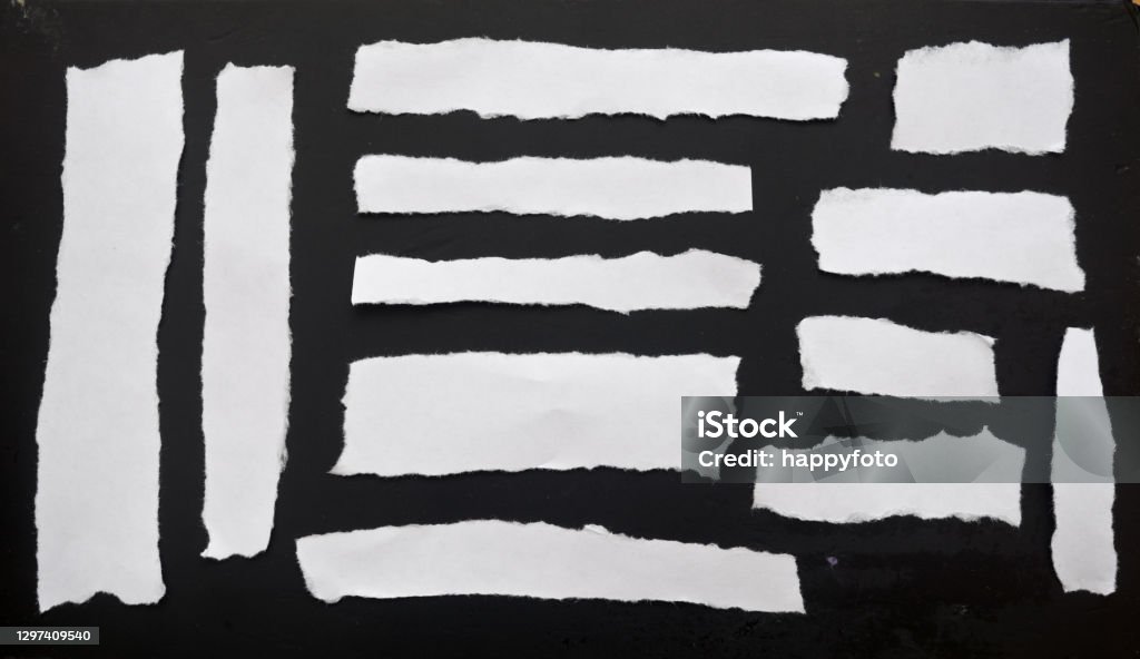 White papers White papers on a black background Newspaper Stock Photo