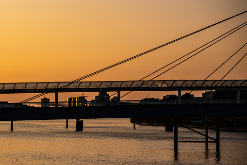 Sunset on the River Clyde in Glasgow Scotland With Bridge Silhouette and Copy Space