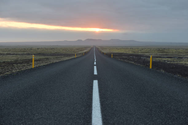 istock Road through volcanic landscape in Iceland 1297411029