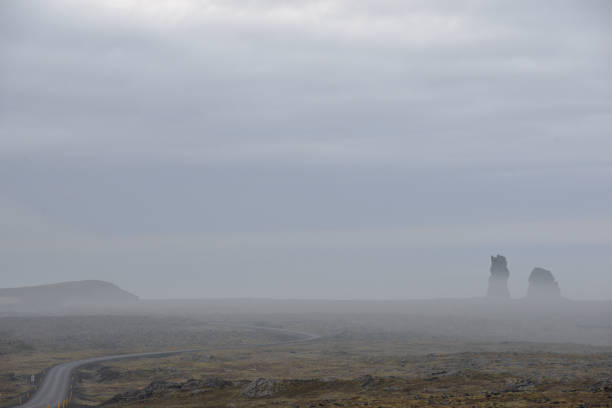 istock Road through volcanic landscape in Iceland 1297411076