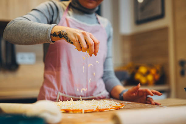 istock It's raining cheese - Making pizza True Italian Neapolitan pizza at home 1297412378