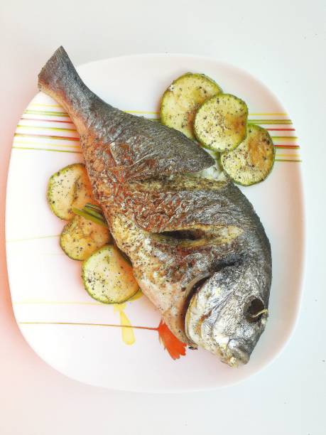 istock grilled dorada with vegetables and spices. 1297412835