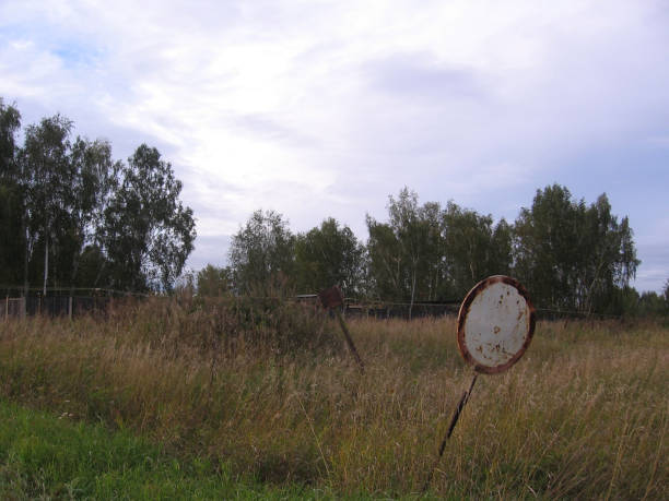 broken traffic sign no passage in the grass