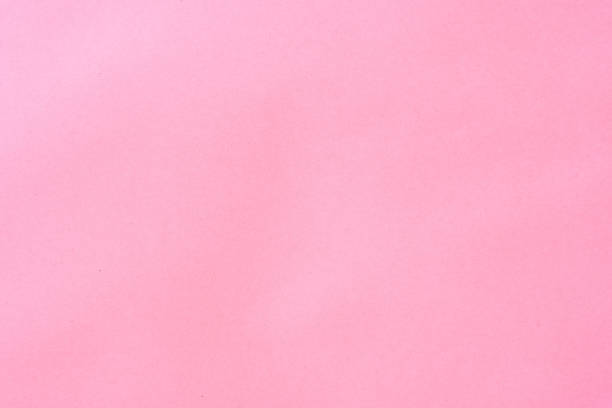 istock Delicate pink background with paper texture. Light, pastel crimson decorative paper 1297413672