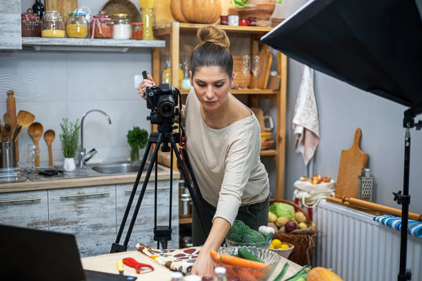istock Young woman in her kitchen creating a cooking vlog 1297413843