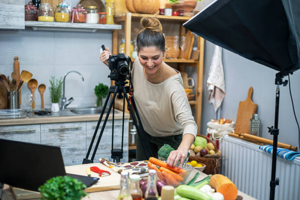 istock Young woman in her kitchen creating a cooking vlog 1297413886