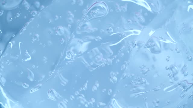 Close-up transparent blue serum gel texture
