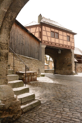 The ancient gate of Rotenburg op der Trauber village in Germany in the wintertime