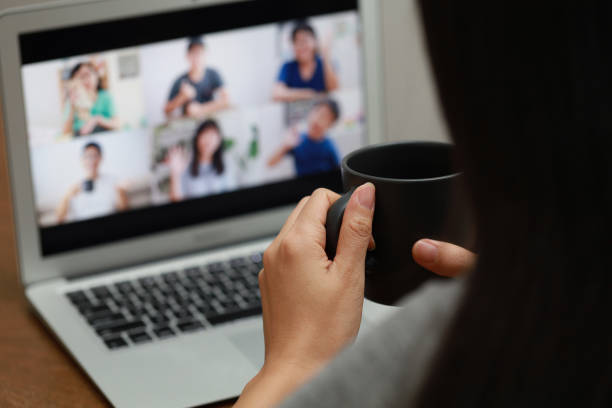 istock Woman at home using a laptop computer video conference during the pandemic lockdown. 1297414821