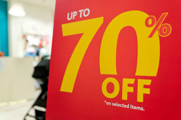 istock 70% discount sign in a shopping mall 1297415998