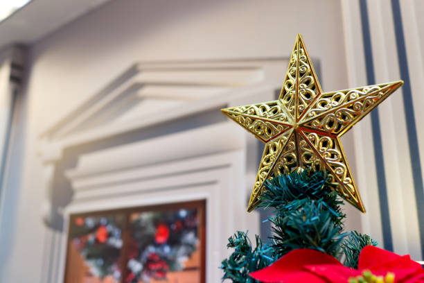 istock Christmas star decorated on Christmas tree closeup 1297416037