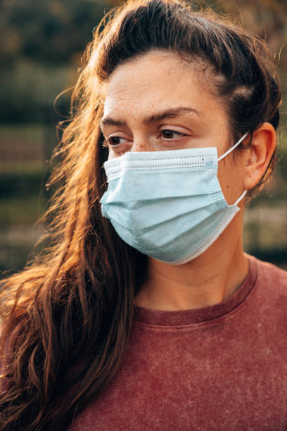 istock sad woman eyesight with face mask during the covid 1297419286