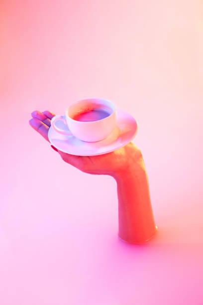 istock Close up female hand gesturing from the milk bath with soft glowing in neon light 1297420014