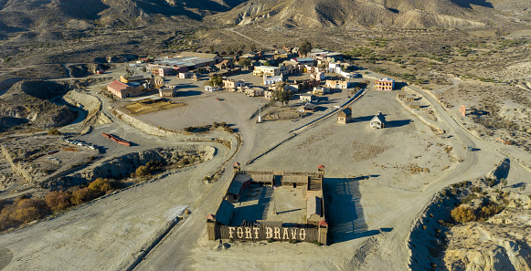 Drone above view of Tabernas Desert Landscape  Texas Hollywood Fort Bravo the western style theme park in Almeria Andalusia Spain Europe
