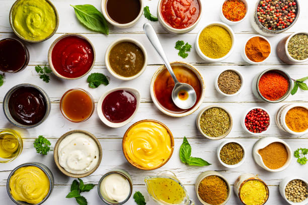 Set of different dip sauces Set of different bowls of various dip sauces on white background, top view condiment stock pictures, royalty-free photos & images