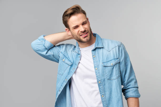 istock young handsome man with neck paint standing over grey background 1297420820