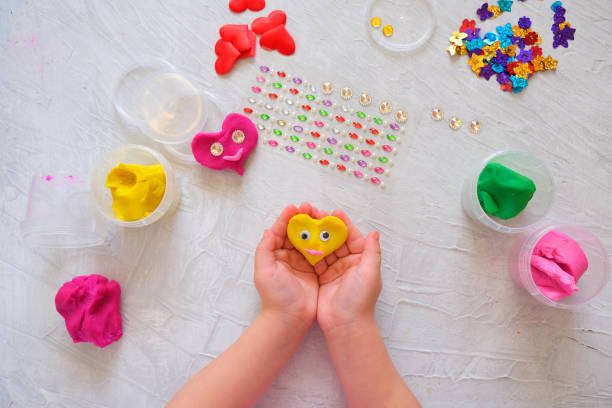 istock Child playing with colorful modeling clay 1297421211