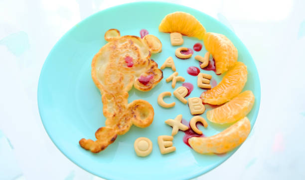 istock cute funny animal pancakes with jam 1297421729