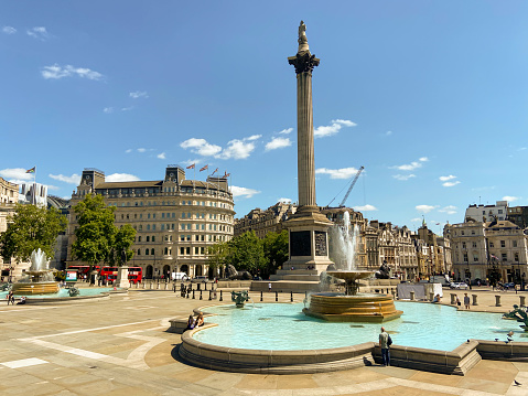 London, United Kingdom - June 22 2020: Daytime view of Trafalgar Square with a clear blue sky.