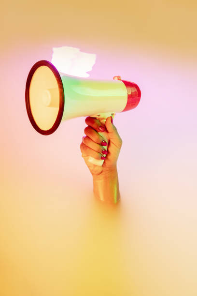 istock Close up female hand gesturing from the milk bath with soft glowing in neon light 1297421821