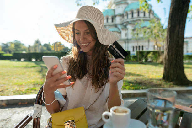istock Woman shopping on-line with her smart phone 1297422749