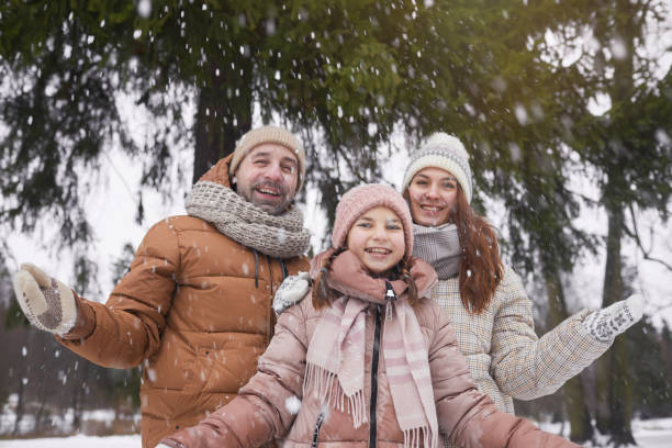 istock Family Playing with Snow in Winter 1297424217
