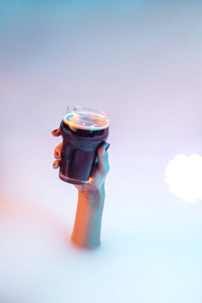 istock Close up female hand gesturing from the milk bath with soft glowing in neon light 1297424969