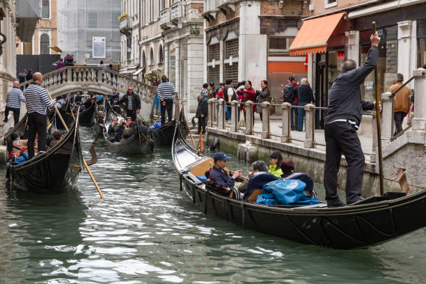 Venice, Italy - April 30, 2015: Traffic jam of gondolas in Venice, Italy