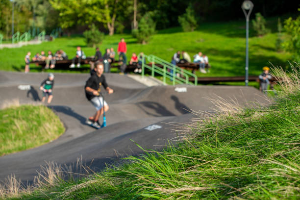 Skatepark for cyclists, inline skaters, nestled in the grass outside by day