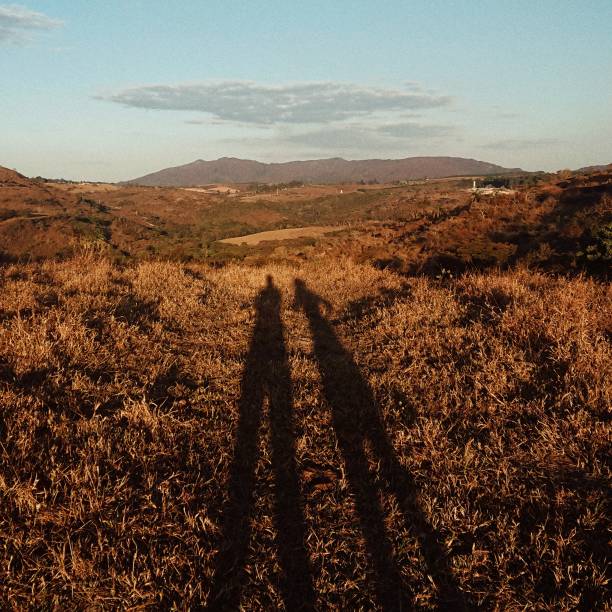 istock shadow of people in a landscape 1297427795