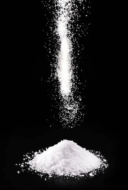 spilled calcium chloride, falling. It is a chemical substance, coarse salt, used in the industry