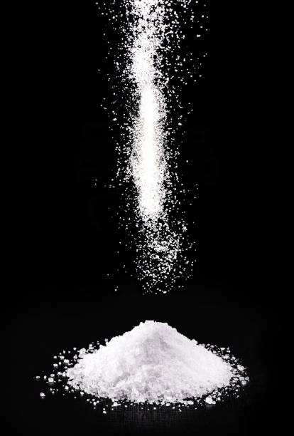 spilled calcium chloride, falling. it is a chemical substance, coarse salt, used in the industry - sulfide imagens e fotografias de stock