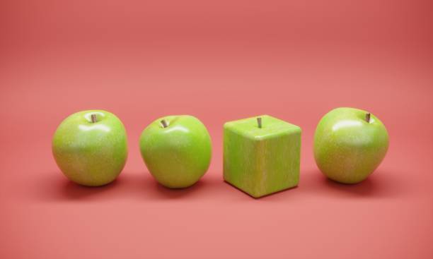 Cube Shaped Apple Cube shaped apple between the normal apples. ( 3d render ) standing out from the crowd stock pictures, royalty-free photos & images