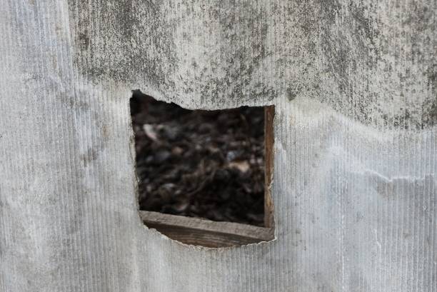 istock gray concrete wall with a large square hole in the street 1297432321