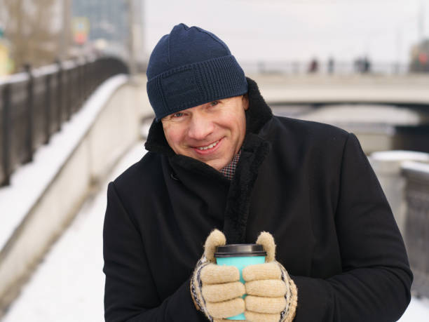 istock Man drinking coffee at the city street 1297432980