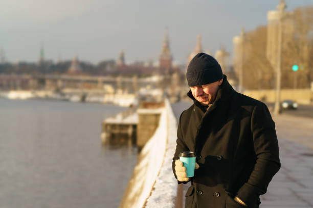 istock Man drinking coffee at the city street 1297432998