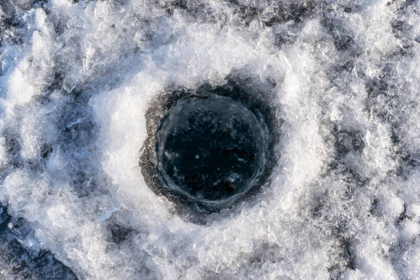 Winter fishing hole in the ice