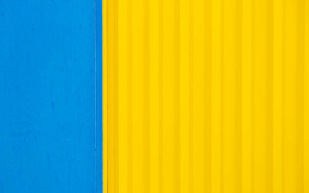 istock Bright yellow colour and blue color painted metal. 1297442271