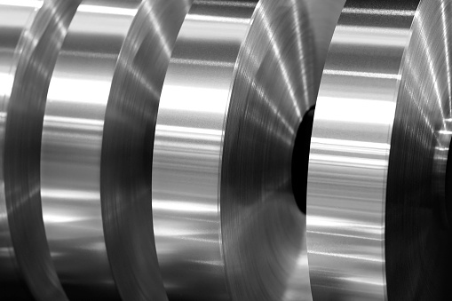 final coils of aluminum foil after slitting on the axis machine, black and white photo
