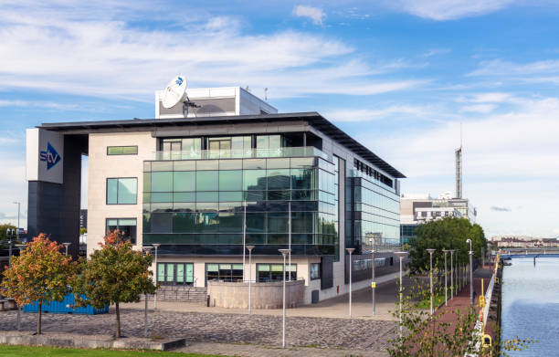 STV Headquarters in Glasgow Glasgow, Scotland - The headquarters building of the broadcaster STV, located on Pacific Quay on the south bank of the River Clyde. itv photos stock pictures, royalty-free photos & images