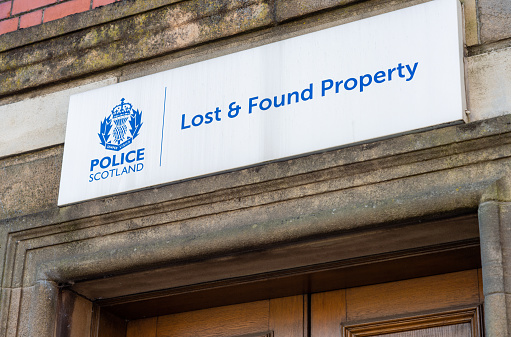 Glasgow, Scotland - A sign above a door to the lost and found property department of the police in central Glasgow.