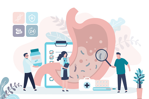 Group of doctors examine stomach for diseases. Diagnosis and treatment of gastritis. Digestive system checkup. Concept of gastroenterology, healthcare and medicine. Trendy flat vector illustration